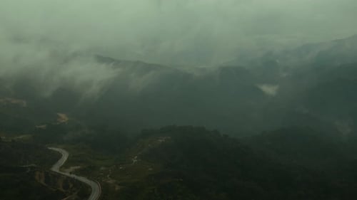 The Misty Fog Blowing Over the Forest Creates a Beautiful and Natural Scene in the Mountain