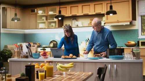 Senior Couple Dancing in Kitchen in the Morning
