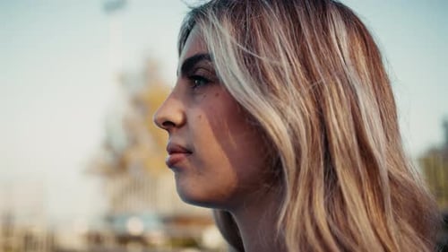 Woman's Profile with Blonde Hair in City
