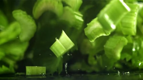 Pieces of Chopped Celery Fall on the Table Filmed on a Highspeed Camera at 1000 Fps