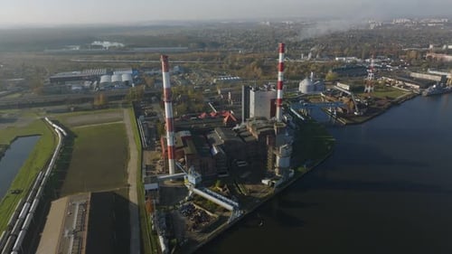 Aerial view of an industrial power plant complex along a river