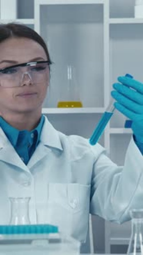 Scientist Analyzing Liquid Sample in Laboratory