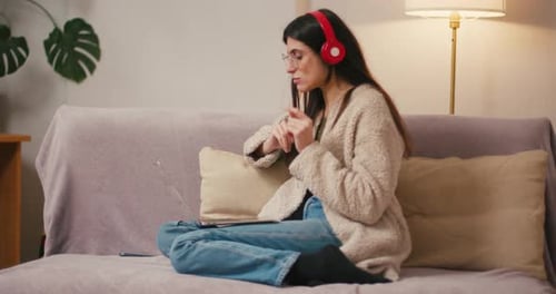 Woman Working Remotely on Laptop Doing Video Call