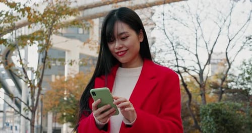 Japanese woman, city and laugh with phone for reading funny notification