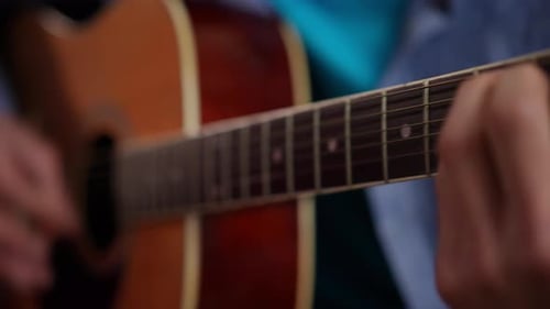 Man Playing Acoustic Guitar Close Up