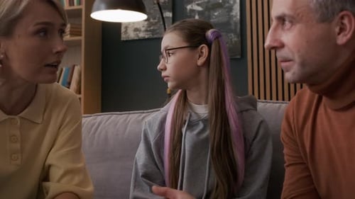 Teenager Getting Frustrated Listening to Parents Fighting