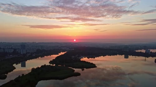 Sunrise flight on river in city