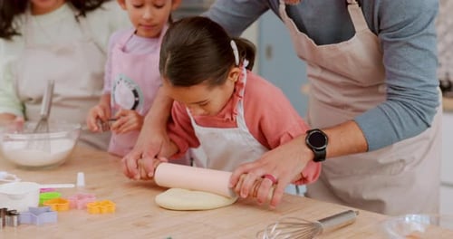 Happy Family Baking Cookies Together in Kitchen