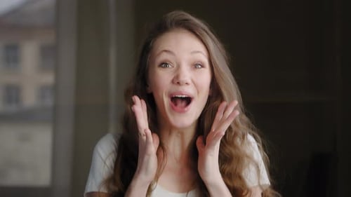 Surprised and Happy Woman Celebrating Success