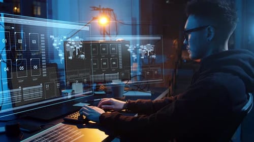 Man Coding on Computers at Night