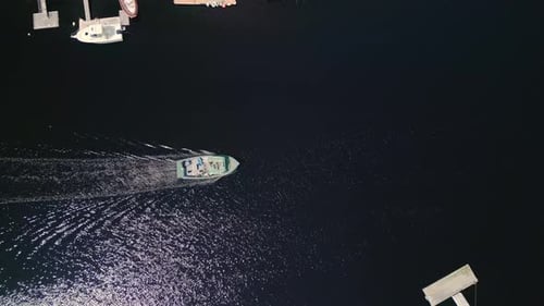 Aerial View of a Traditional Fishing Boat Sailing Into the Port