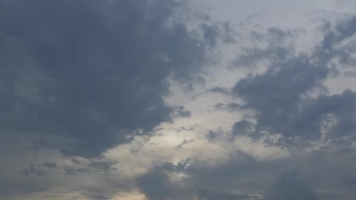 Sun Shining Through Dark Moody Clouds Time Lapse