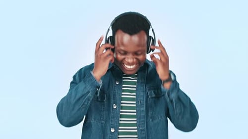 Music, headphones and excited black man in studio for streaming song, radio and audio