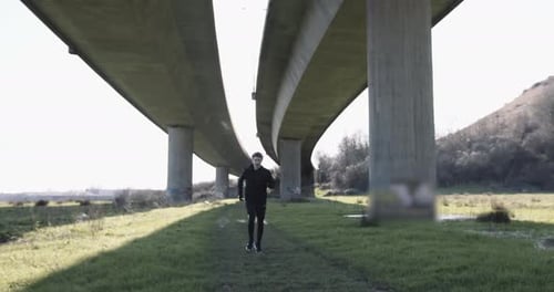 Adult man running athlete sprinting workout challenge training endurance in urban city