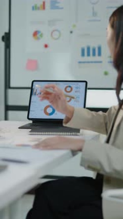 Woman Working with Tablet in Modern Office
