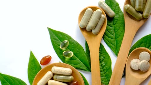 Herbal Medicine Tablets with Natural Green Leaves