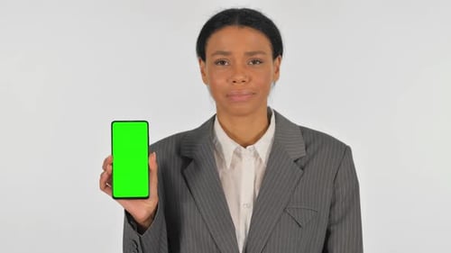 Portrait of Businesswoman Showing Smartphone with Green Screen on white Background