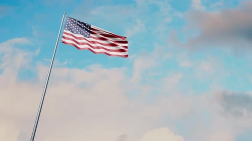 Realistic American Flag Waving on Flagpole Against Blue Sky