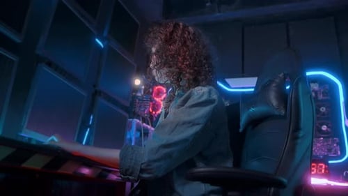 an asian woman programmer is working in her computer room