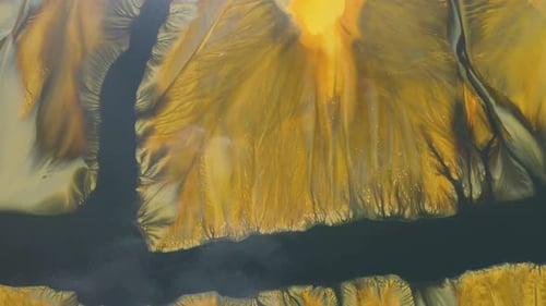 Flying over contaminated mine waters in decanting pond aerial view. Environmental pollution