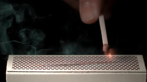 Match Ignites with Bright Flame Close Up