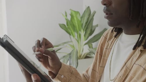 Man Using Digital Pen and Tablet Device