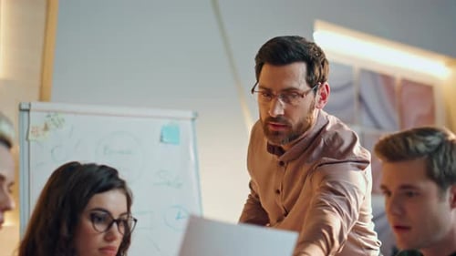 Corporate Team Discussing Business in Bright Modern Office