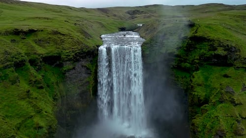 Majestic Seljalandsfoss Waterfall Cascading Over Green Cliffs in Icelands Serene Landscape