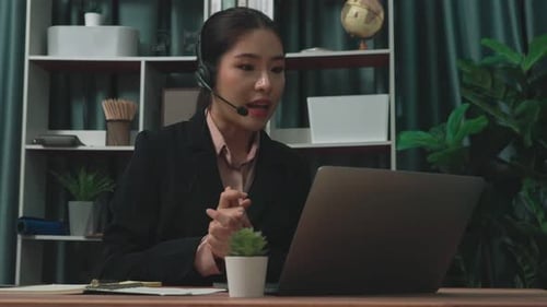 Professional Woman Engaged in a Video Conference Call
