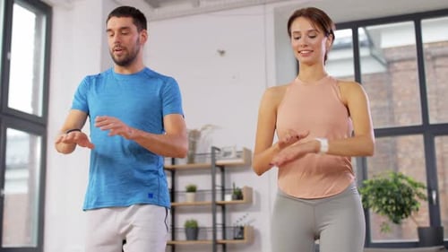 Sport, Fitness, Lifestyle and People Concept. Smiling Man and Woman Exercising And