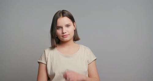 Teen Girl Smiling and Adjusting Hair
