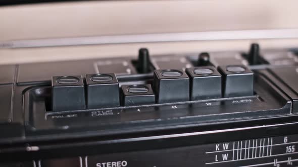 Vintage Boombox Pressing Play and Stop Buttons, Technology Stock ...
