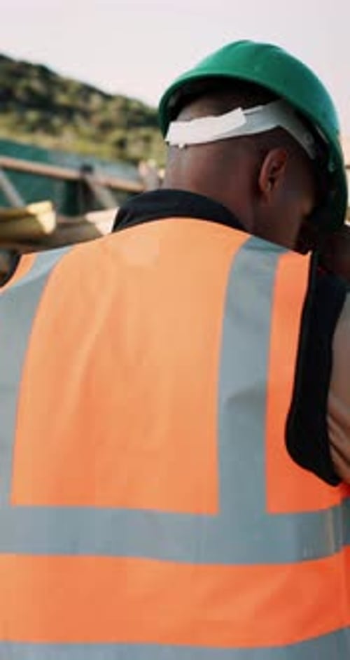 Construction, building and black man with helmet for reflection, idea and planning for property