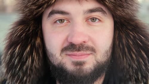 Smiling Man in Winter Fur Hood Close Up