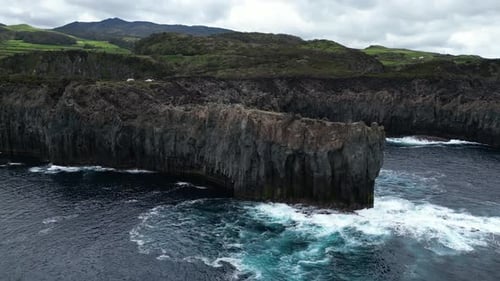 Dramatic coastal cliffs and rugged landscape from above