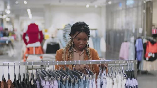 Woman Doing Shopping in Clothing Department