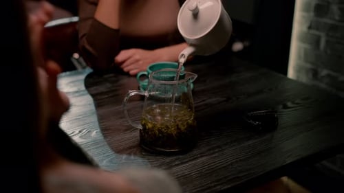 Close Up of Tea Service with Two People