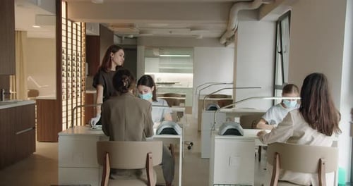 Women Get Manicures at Modern Nail Salon