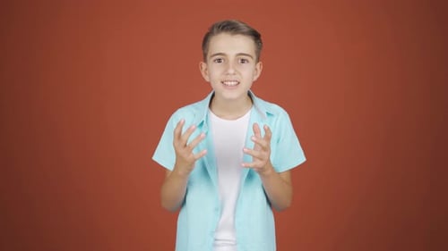 Boy giving motivational speech to camera.
