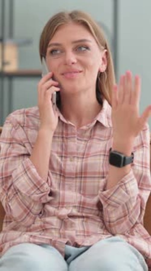 Woman Talking on Phone Indoors