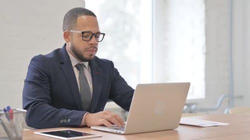 African Businessman Leaving Office after Work