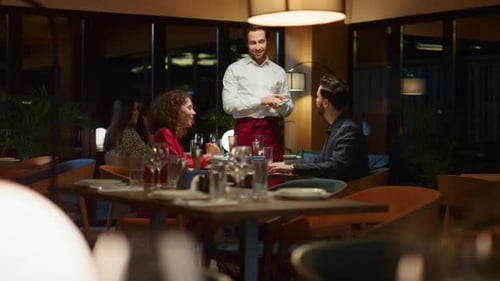 Romantic Couple Order Waiter in Expensive Restaurant Table on Night Date. Multiracial