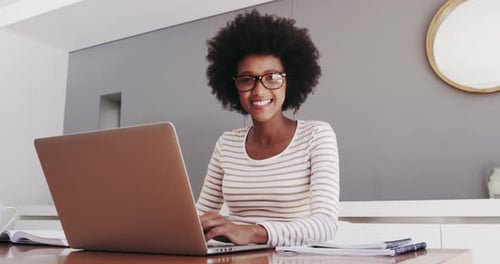 Woman Working on Laptop at Home Smiling