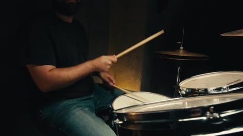 Expressive Drummer Young Man Professionally Playing on Dums in Studio Room Closeup Rock Metall Music