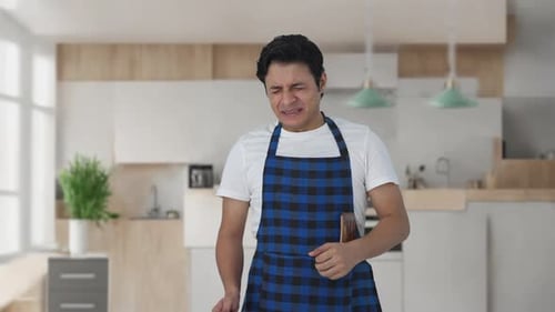 Man Tastes Food and Makes a Face