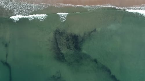 Ocean waves on deserted beach