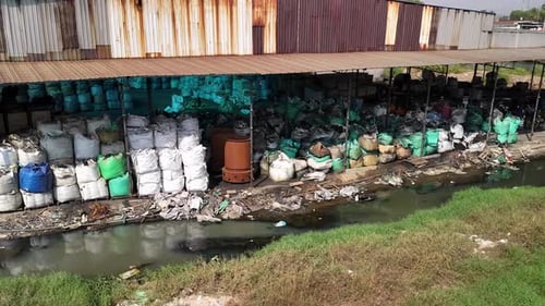 Recycling Plant with Stacks of Colorful Bags