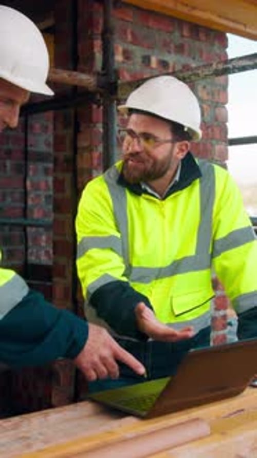 Construction, success or team on site with laptop, task completion or director approval
