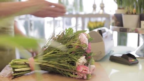 Wrapping Bouquet at the Flower Shop for Customer