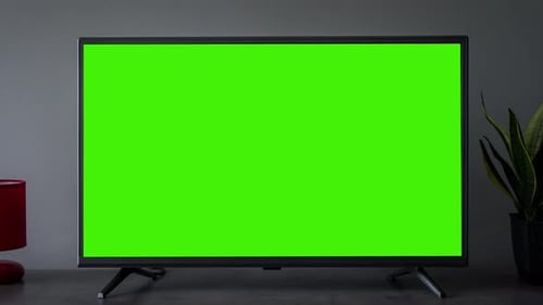 TV Screen Mockup Background Lcd Tv Monitor with Blank Green Screen in Living Room While Watching